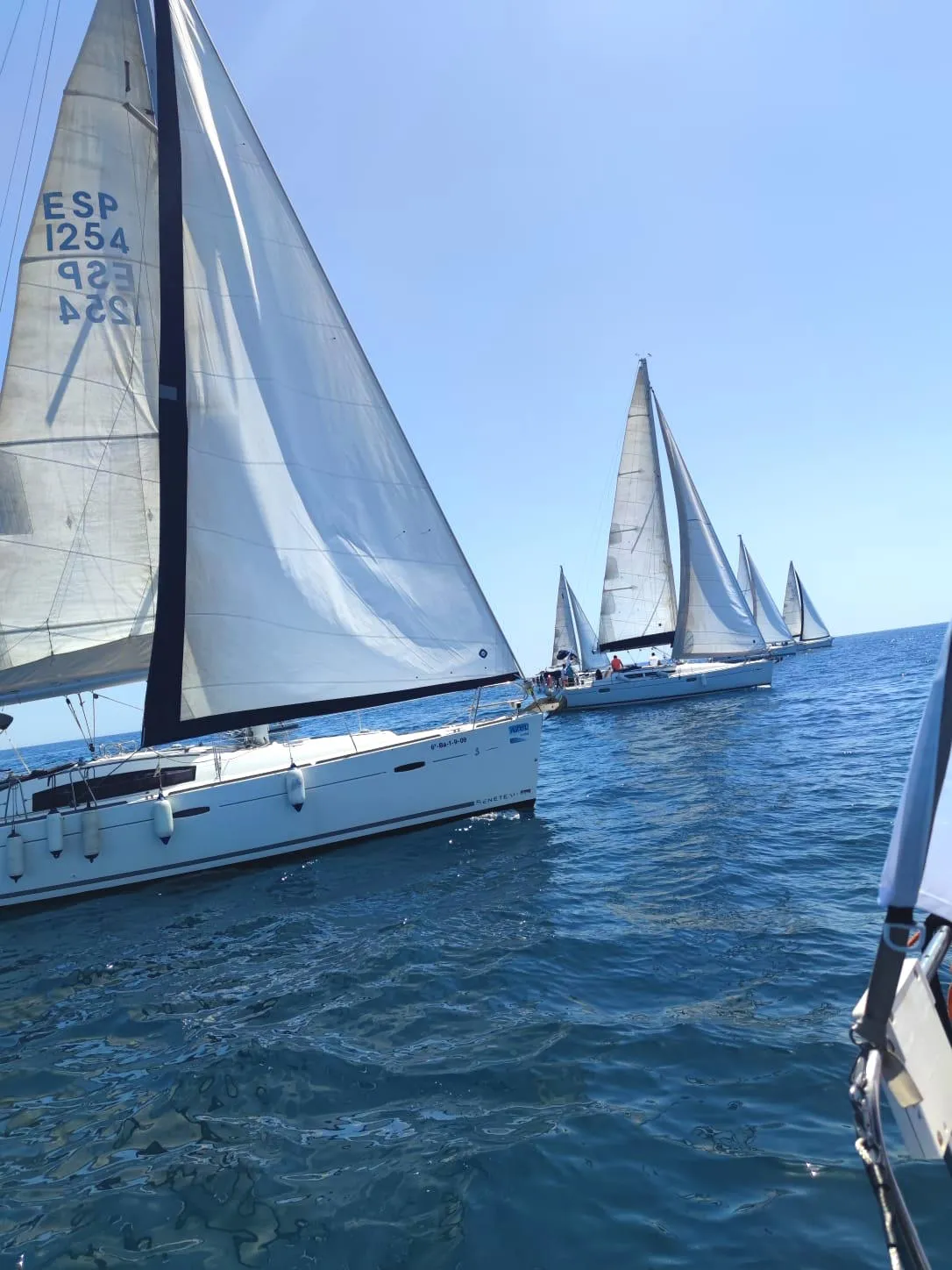 Two sailboats fighting for position during the regatta event
