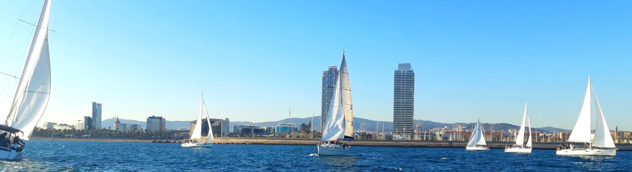 Panoramic view of the regatta fleet in front of Barcelona