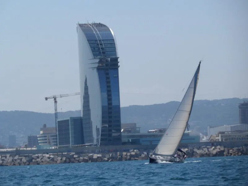Sailboat racing in front of the W Hotel in Barcelona